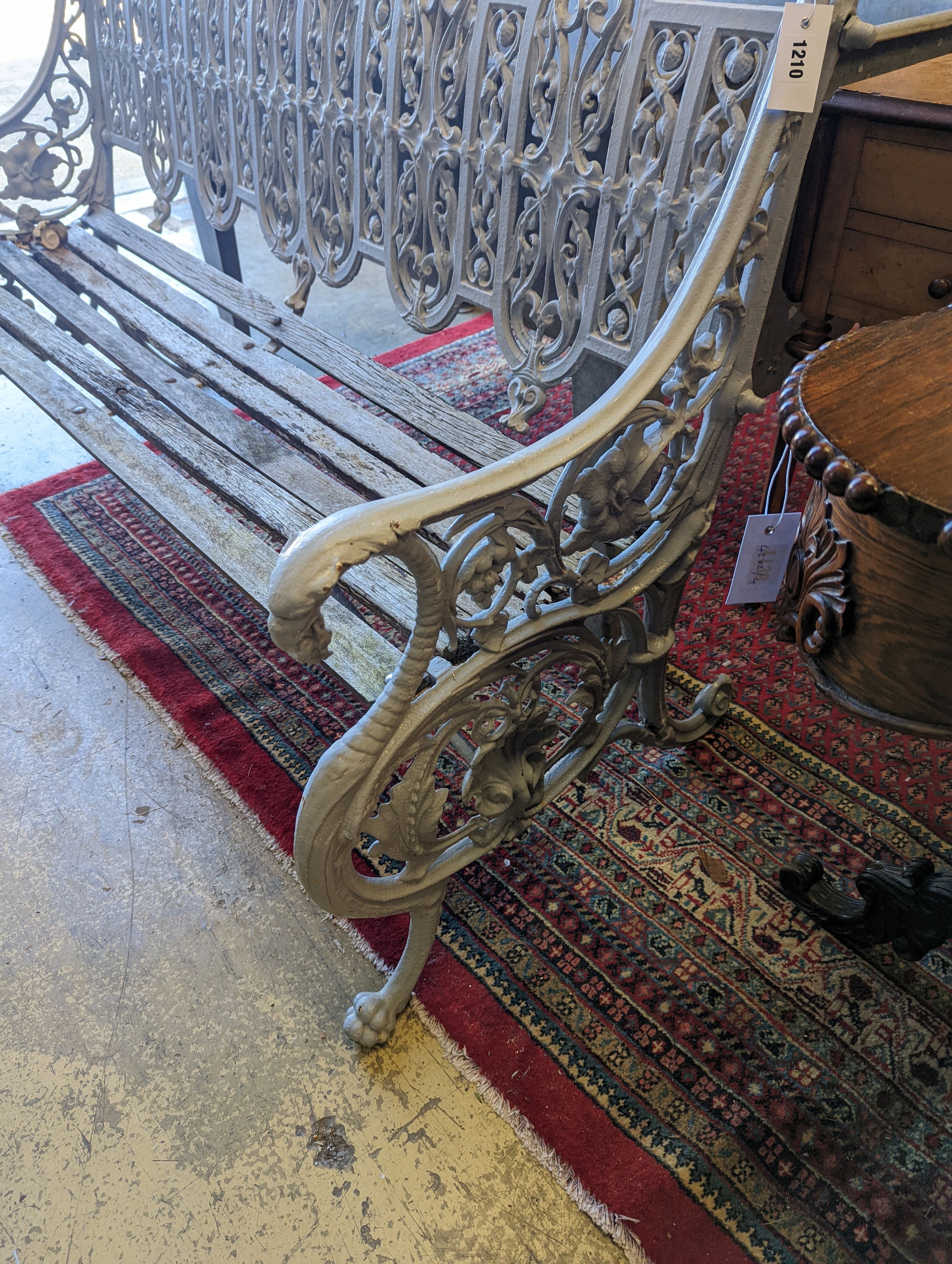 A Victorian Coalbrookdale cast-iron garden bench, length 156cm, depth 68cm, height 94cm (re-painted and seat in need of repair)